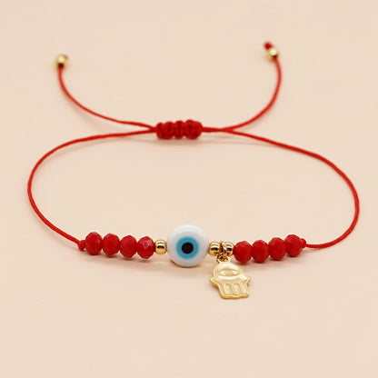 PULSERA ROJA OJO AZUL