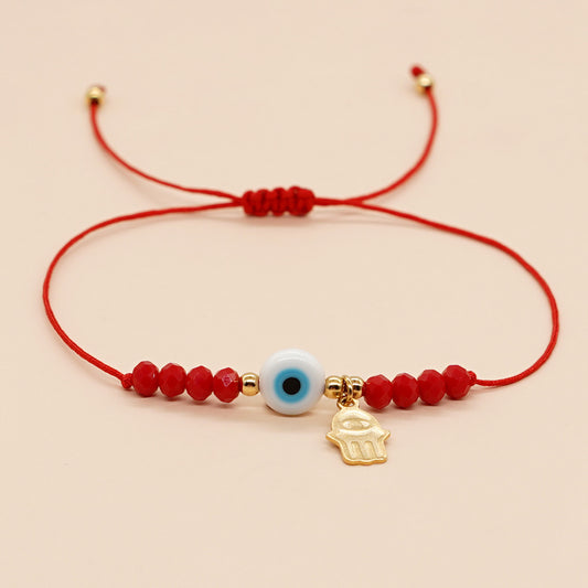 PULSERA ROJA OJO AZUL
