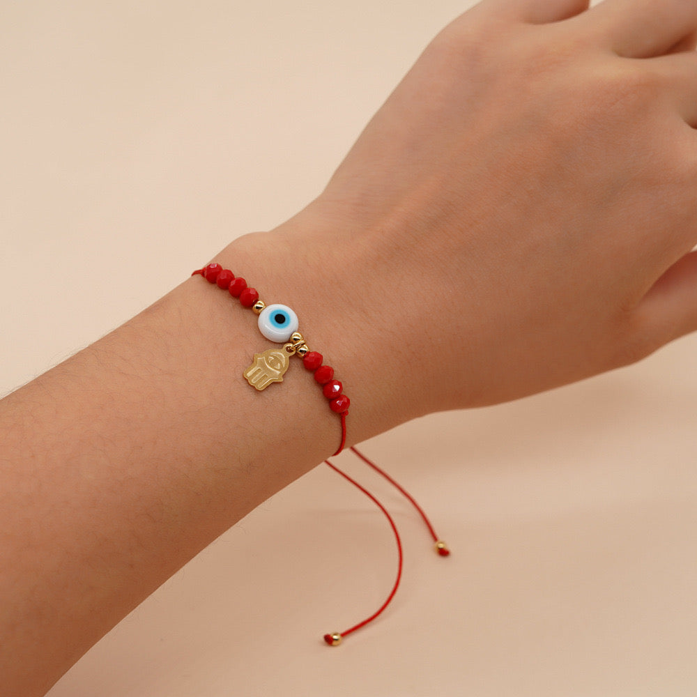 PULSERA ROJA OJO AZUL